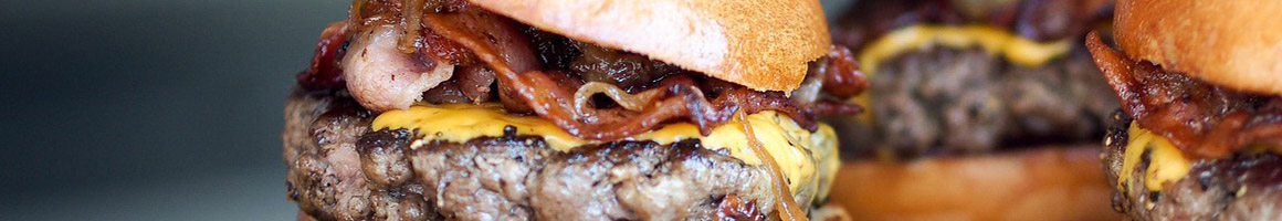 Eating Burger Sandwich at Burger Stop restaurant in Layton, UT.